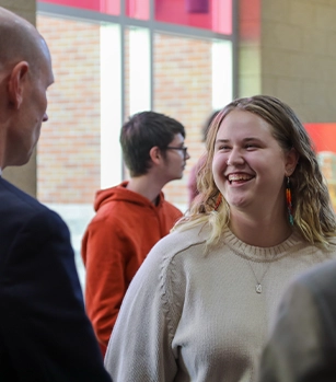 Student talking with President