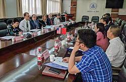 Group of individuals around a large conference table