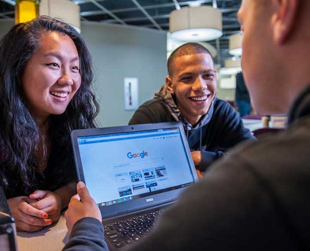 Students studying from a laptop