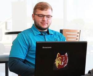 Student studies a laptop
