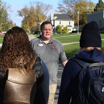 A guide leads a campus tour