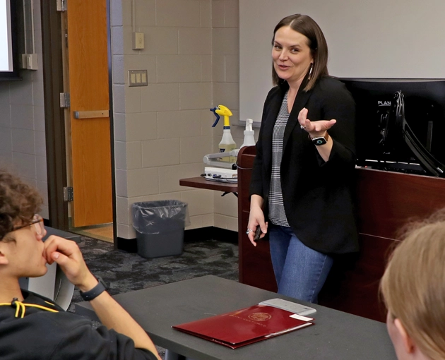 Professor teaching in front of a class of students