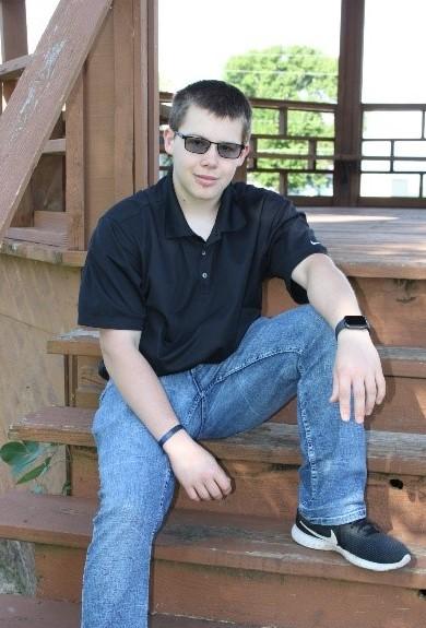 Photo of Darius Swanson sitting on steps