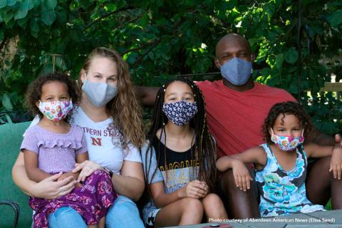 Family picture with all wearing masks