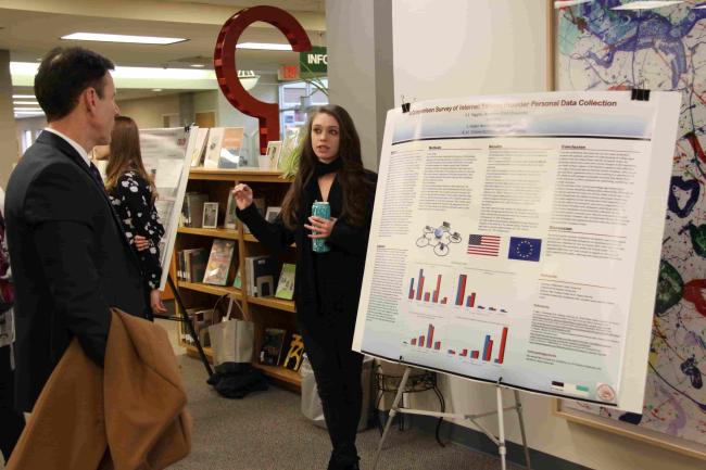 Student presenting research at forum