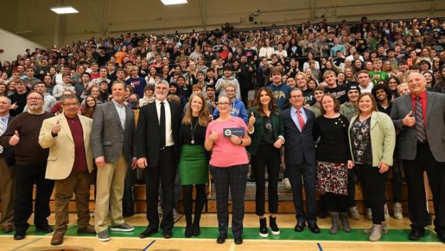 Group shot of a large crowd at a school assembly where Nichole Bowman won her teaching award 